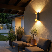 Arc LED wall light on a covered patio wall at night