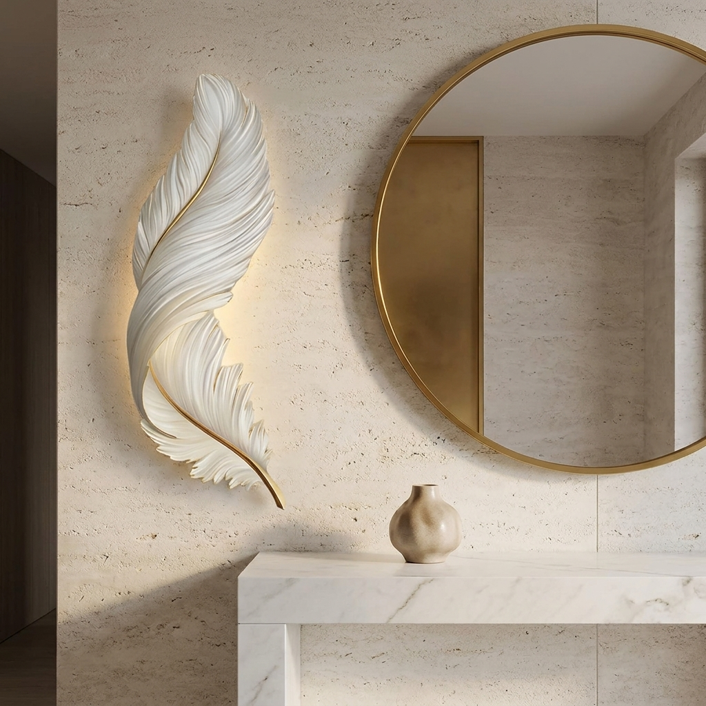 Feather LED wall lamp vertical beside a round mirror and marble console in an entryway