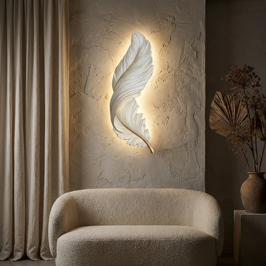 Feather LED wall lamp glowing on plaster wall above a sofa at night